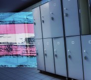 A trans Pride flag alongside a row of lockers in a changing room