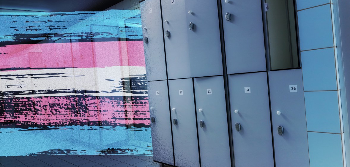 A trans Pride flag alongside a row of lockers in a changing room