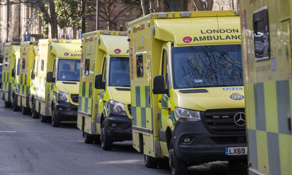 Several ambulances driving through London.