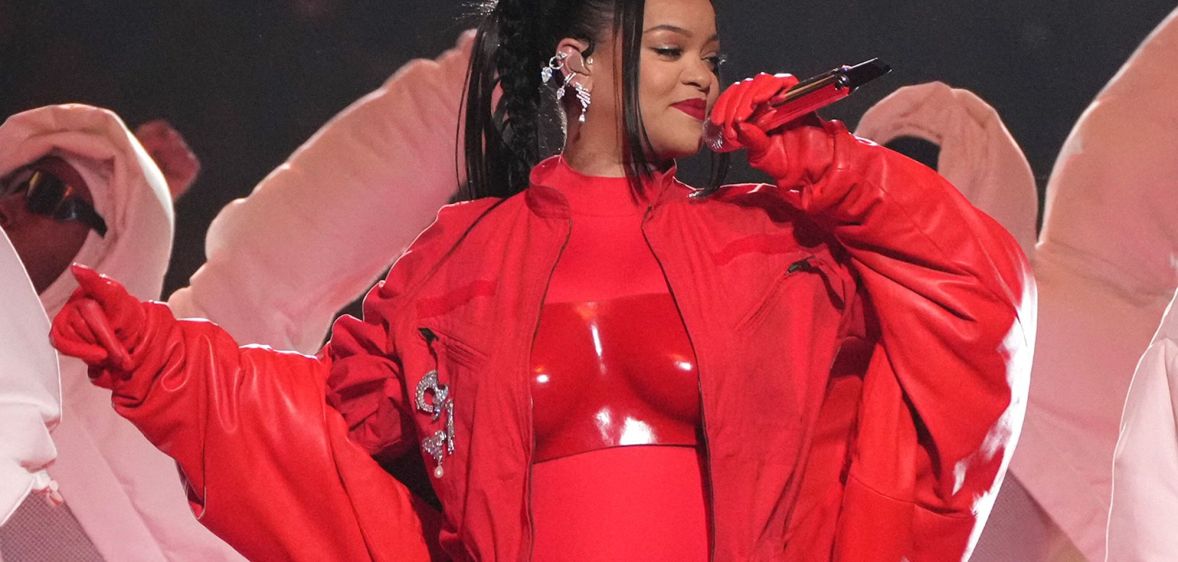 Rihanna in a full red outfit duruing the Super Bowl halftime show.
