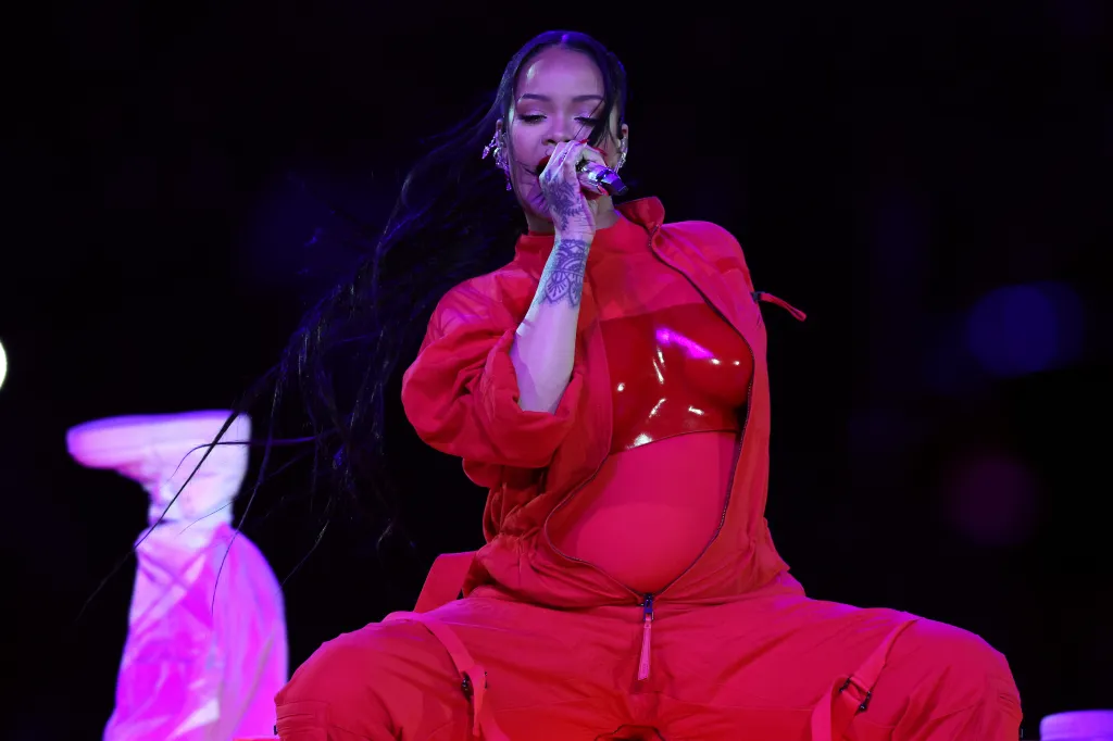 Rihanna stuns in red maternity get up. (Gregory Shamus/Getty)