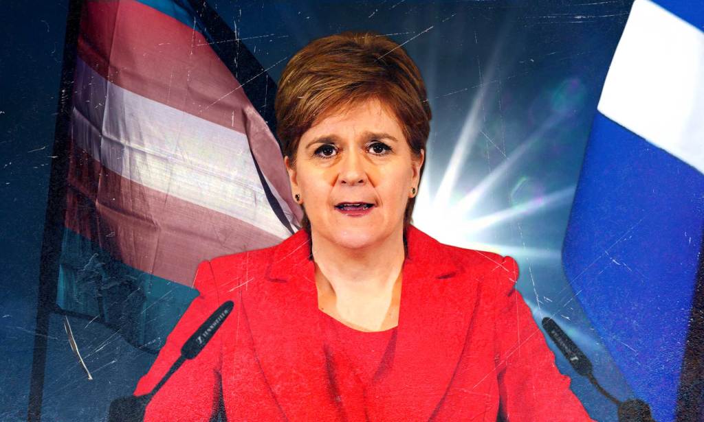 Nicola Sturgeon pictured in the centre delivering her resignation speech at a press conference in Edinburgh. She is wearing a red suit. In the background an edited graphic shows a trans flag and a Scottish flag.