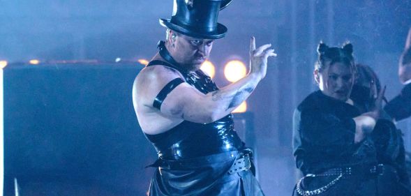 Sam Smith performs at the Brit Awards wearing a latex vest, top hat and devil horns.