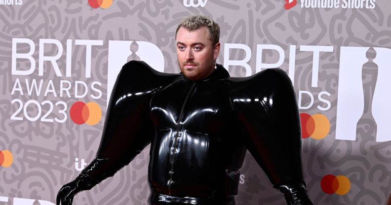 Sam Smith wearing a black Valentino latex suit on the Brit Awards red carpet.