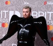 Sam Smith wearing a black Valentino latex suit on the Brit Awards red carpet.