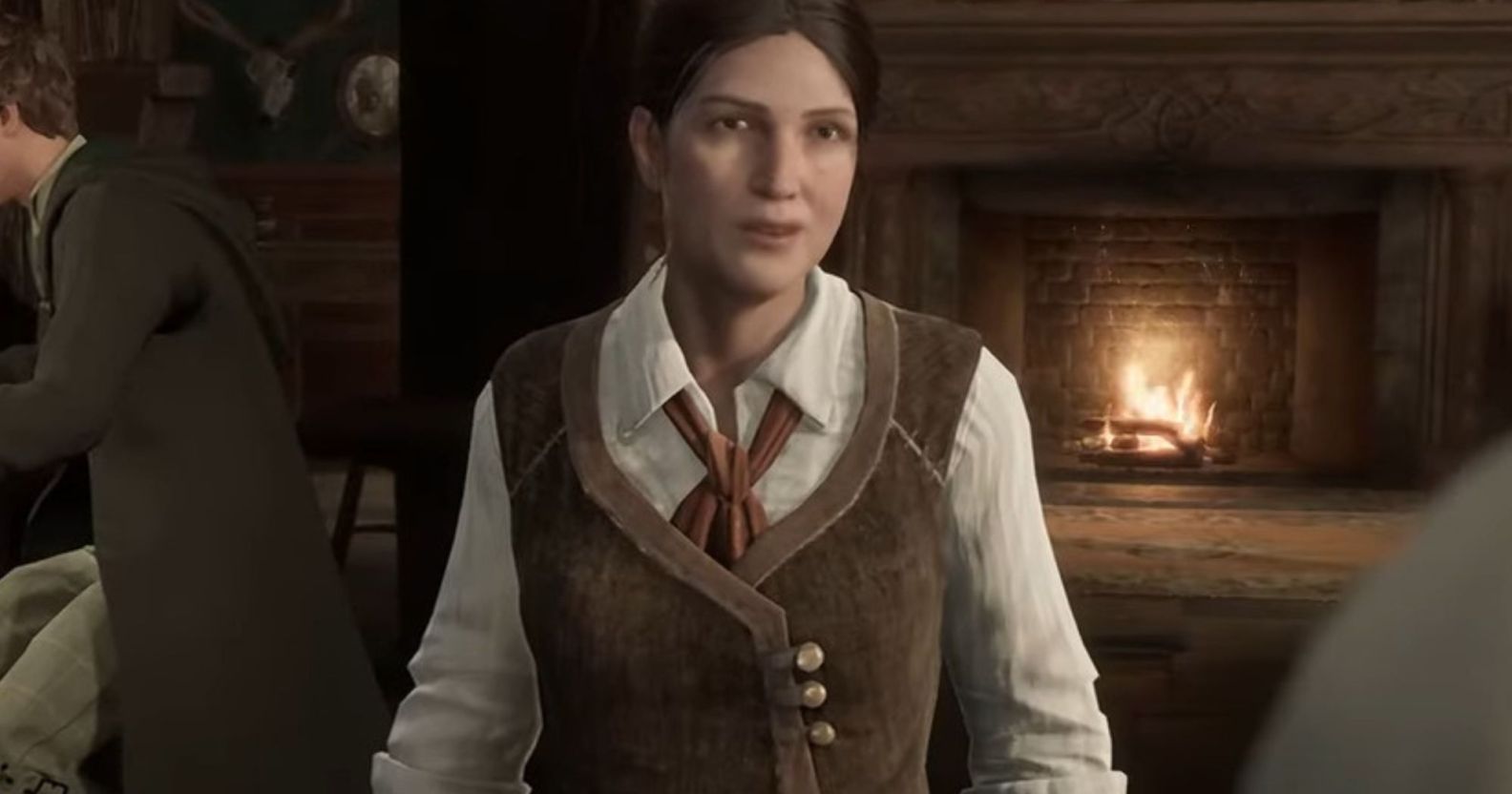 A screenshot from Hogwarts Legacy video game showing trans character Sirona Ryan wearing a white shirt and brown waistcoat
