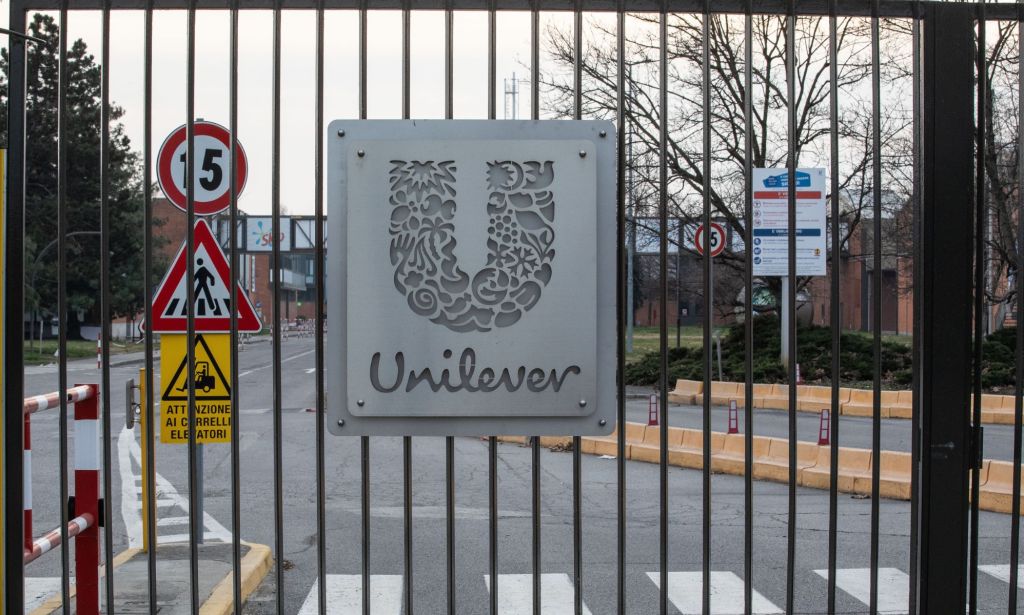 This is an image of a metal gate. The Unilever logo is in the center
