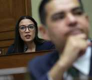 Alexandria Ocasio-Cortez (D-NY) (L) listens during a hearing before the House Oversight and Accountability Committee at Rayburn House Office Building on Capitol Hill (Alex Wong/Getty Images)