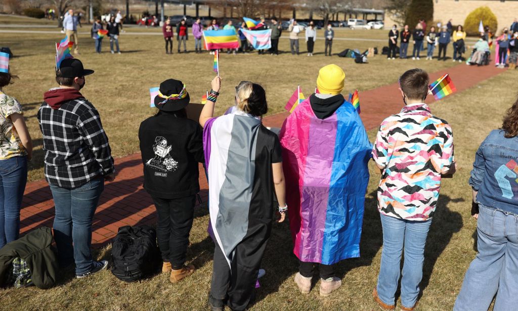 High school in Massachusetts wear pride flags and hold up signs in support of the LGBTQ+ community as they walked out in support of a nationwide student protest over Florida's 'Don't Say Gay' measure