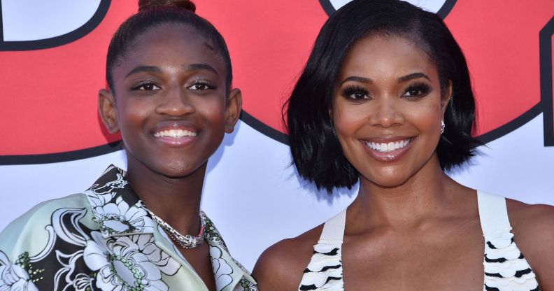 Gabrielle Union stands besides Zaya Wade as they both smile at the Cheaper by the Dozen premiere