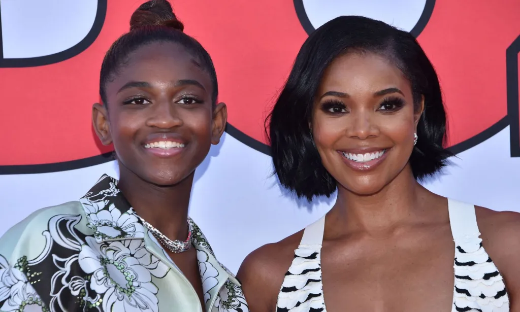 Gabrielle Union stands besides Zaya Wade as they both smile at the Cheaper by the Dozen premiere