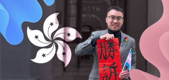 Trans Activist Henry Edward Tse holds up a 'fai chun', a decoration for Lunar New Year, with 'legal victory' (勝訴) written on the red paper outside Hong Kong's Court of Final Appeal