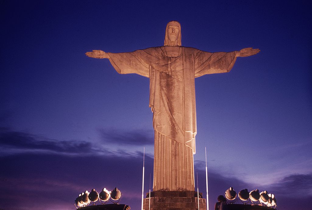 View of the Statue of Christ, the Redeemer lit up at night on Corcovado mountain, Rio de Janeiro.