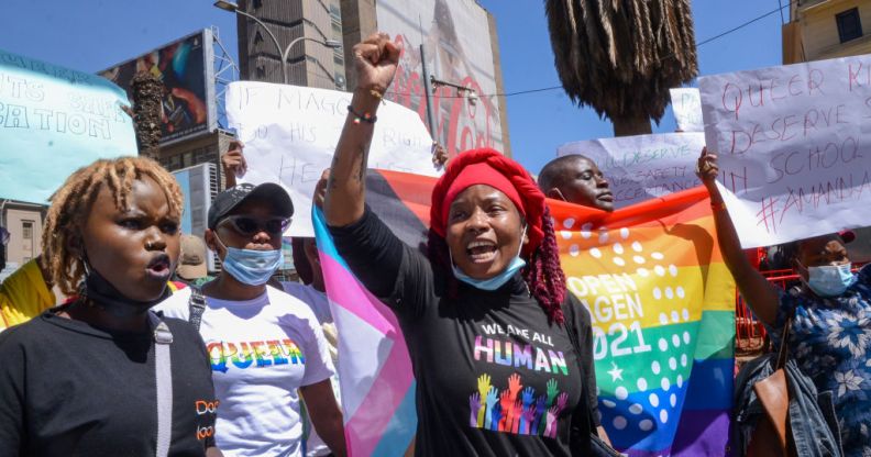 Demonstrators hold placards and chant slogans during the protest in Nairobi.
