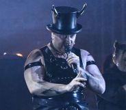 Sam Smith wears a horned top hat while they perform their song 'Unholy' at the 2023 Brit Awards