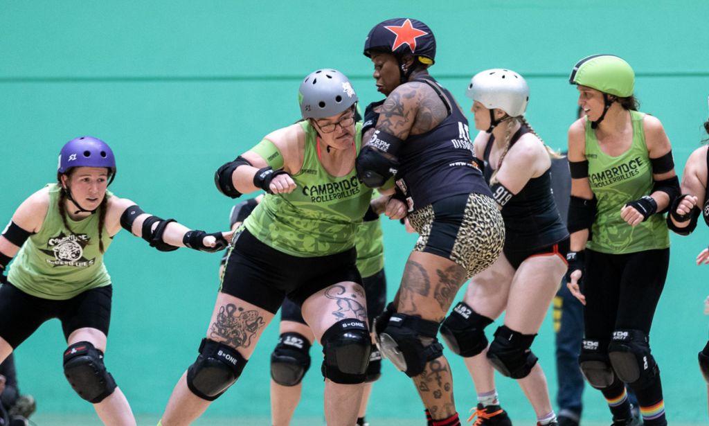 Members of a scrum in a game of roller derby