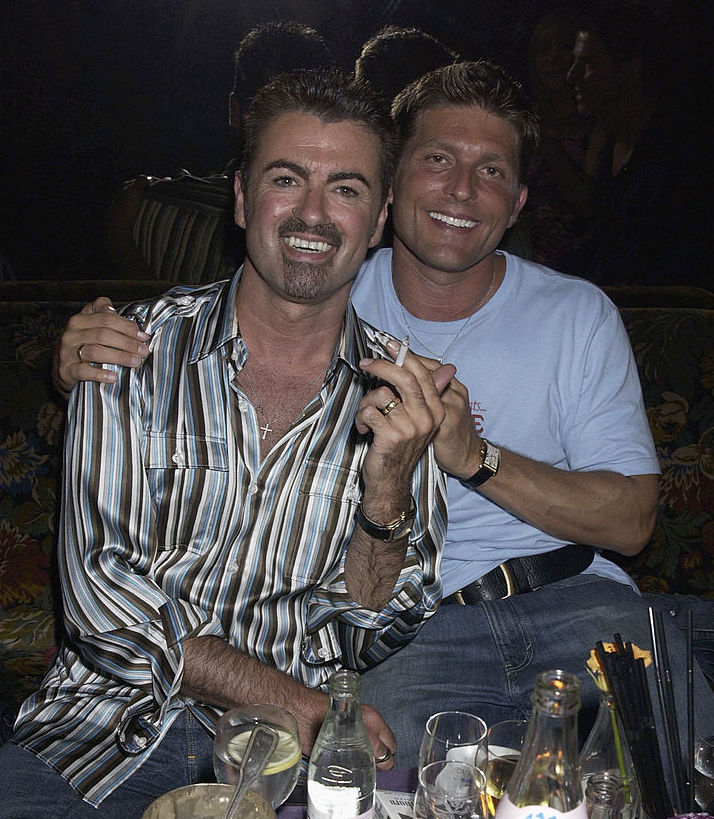 George Michael and his partner Kenny Goss attend the Versace Couture Launch Party hosted by Donatella Versace at The Ritz Hotel in Paris July 9, 2002.