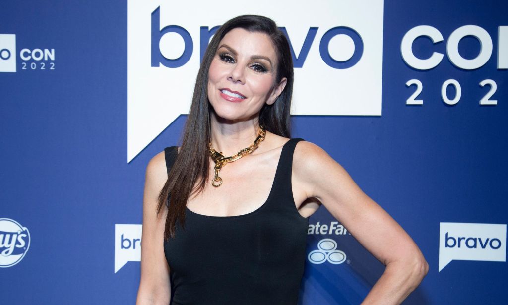 Real Housewives of Orange County star Heather Dubrow wears a black dress as she poses for the camera