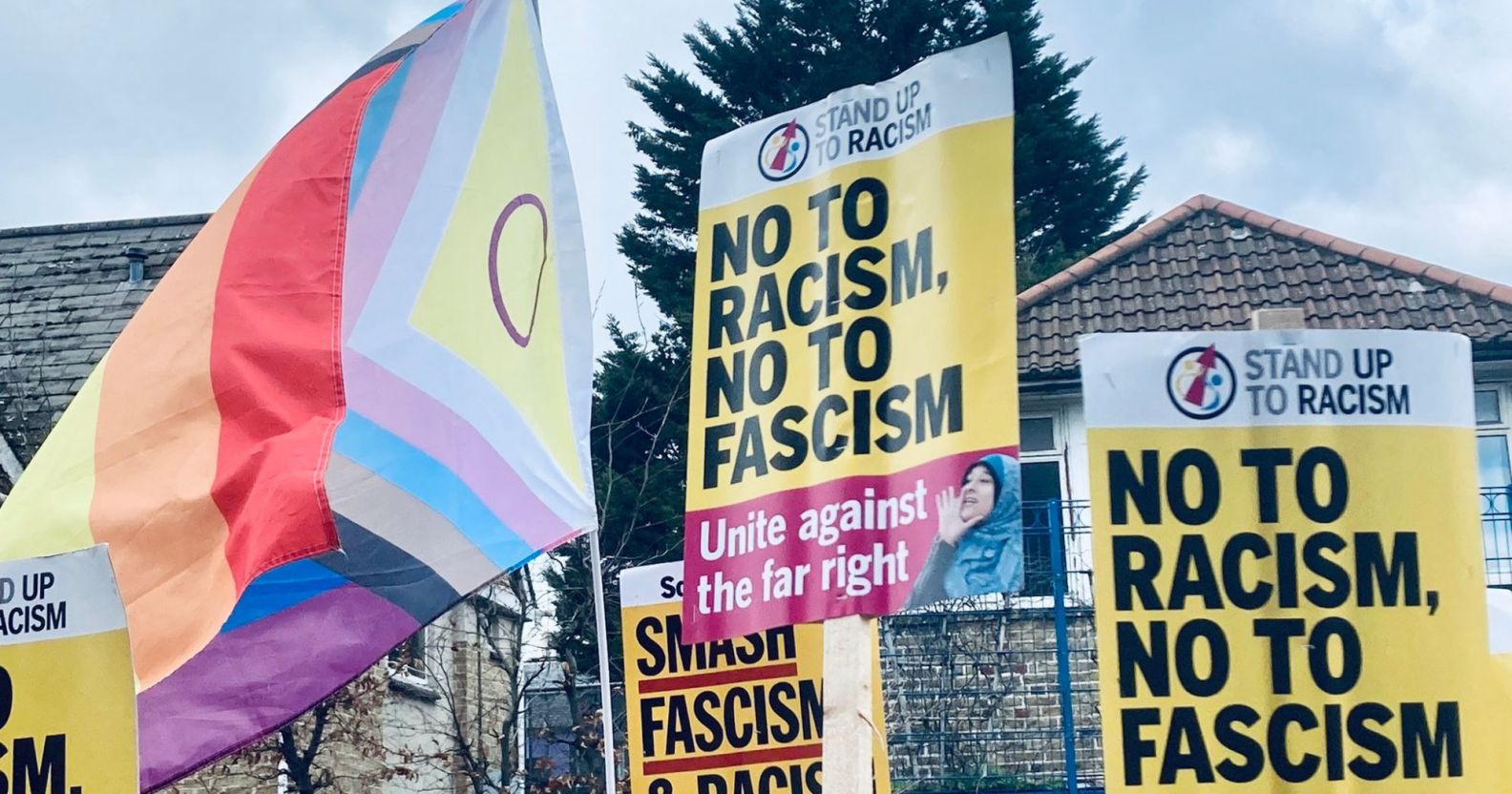 Anti-fascism and LGBTQ+ signs raised at the Honor Oak Pub.