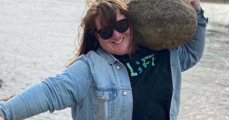 JayCee Cooper lifting a rock