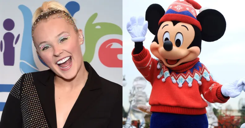 On the left, JoJo Siwa wears a black suit and smiles open mouthed at the camera. On the right, Mickey Mouse waves, wearing a red jumper and red and pink hat.