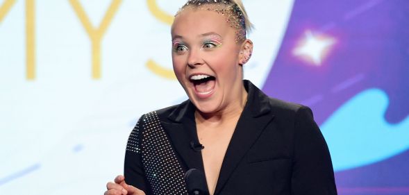 JoJo Siwa onstage during an event.