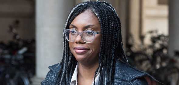 Kemi Badenich in dark jacket and white top