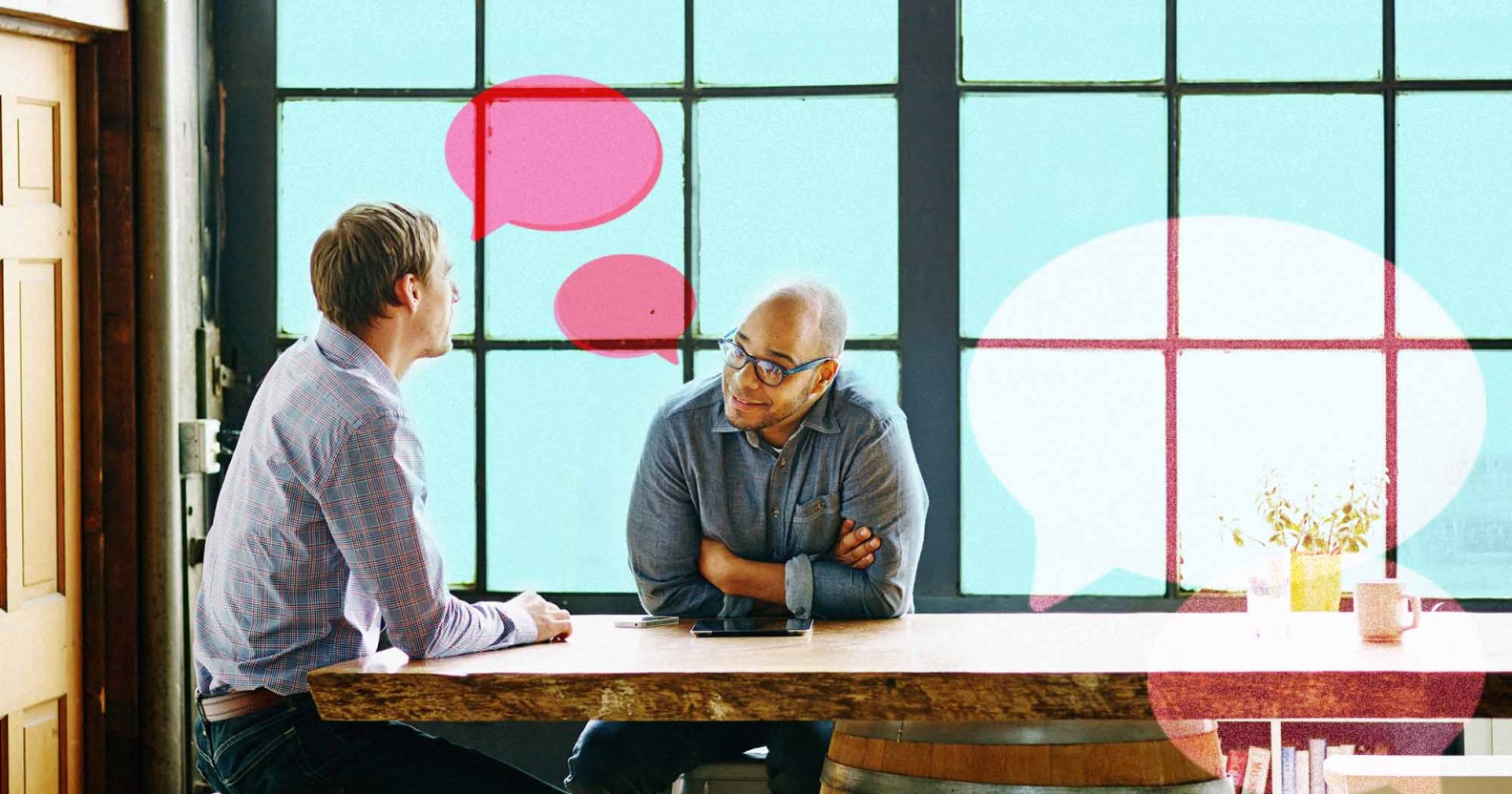 Two men are speaking at a table. One man is wearing classes and looking at the other man. There are illustrations of speech bubbles.
