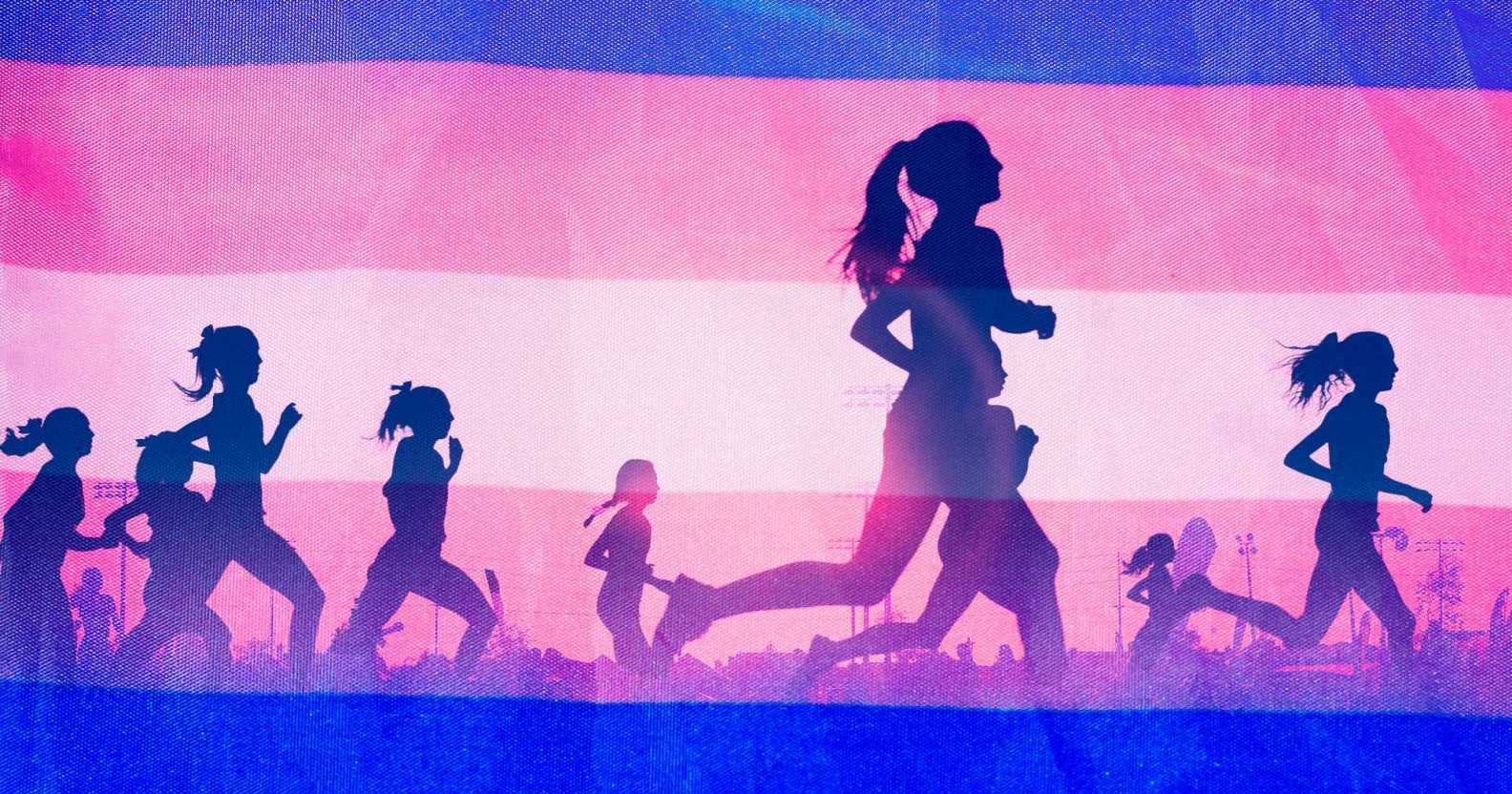 People running in front of a trans flag.