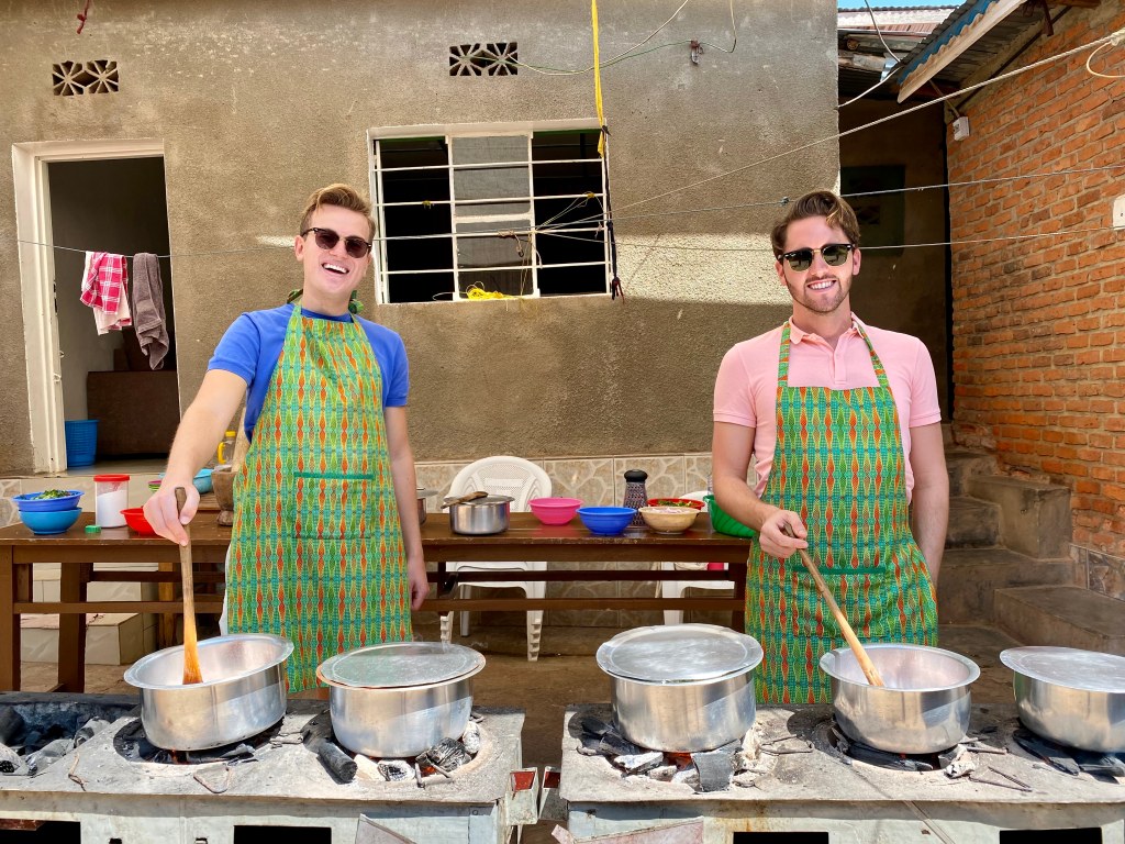 Oskar and Dan pictured in Rwanda at a cooking class. 