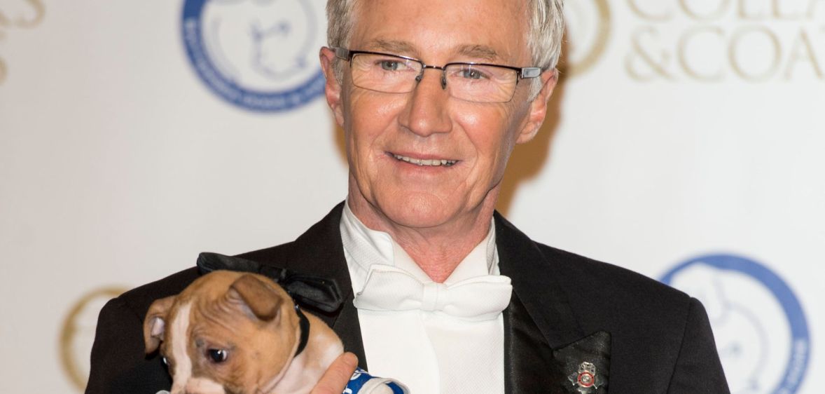 Paul O'Grady holding a puppy