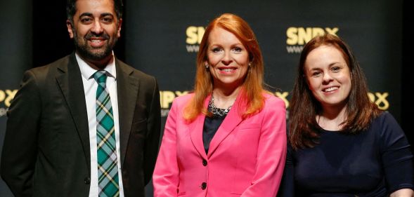 Humza Yousaf, Kate Forbs, and Ash Regan smile for a photo.