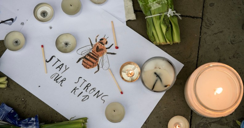 Vigil for victims of Manchester Bombing in May 2017 features drawing of a bee with the words "stay strong our kid"