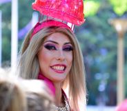 A drag queen smiling during a Pride parade.