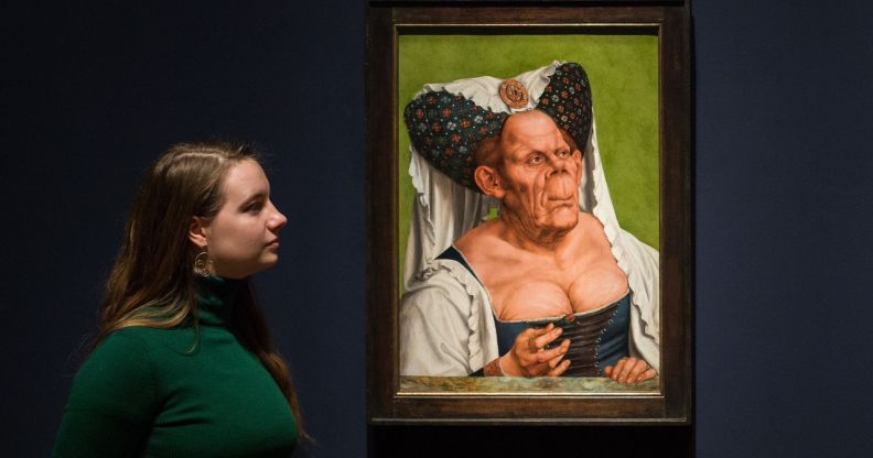 A staff member examine the Ugly Duchess portait.
