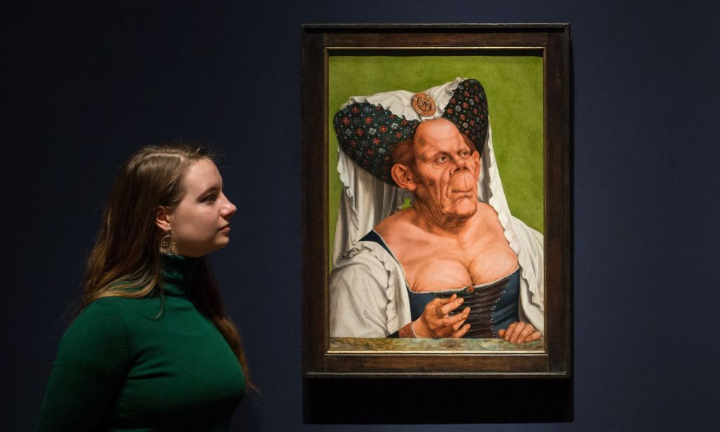 A staff member examine the Ugly Duchess portait.