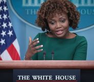 White House press secretary Karine Jean-Pierre wears a green outfit as she gestures with her hand while talking about Tennessee's anti-drag law
