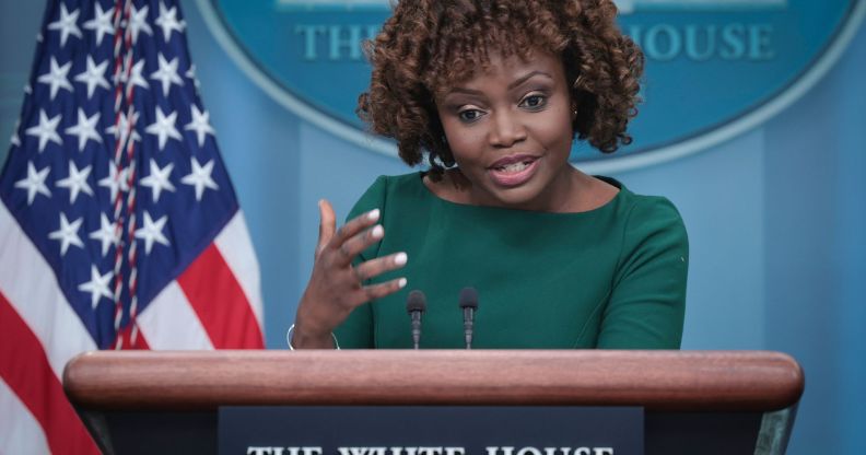 White House press secretary Karine Jean-Pierre wears a green outfit as she gestures with her hand while talking about Tennessee's anti-drag law