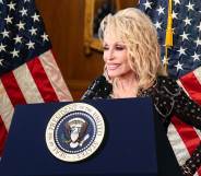 Dolly Parton behind a podium with the presidential seal. The US flag hangs behind her