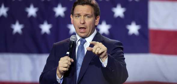 Ron DeSantis in front of a US flag