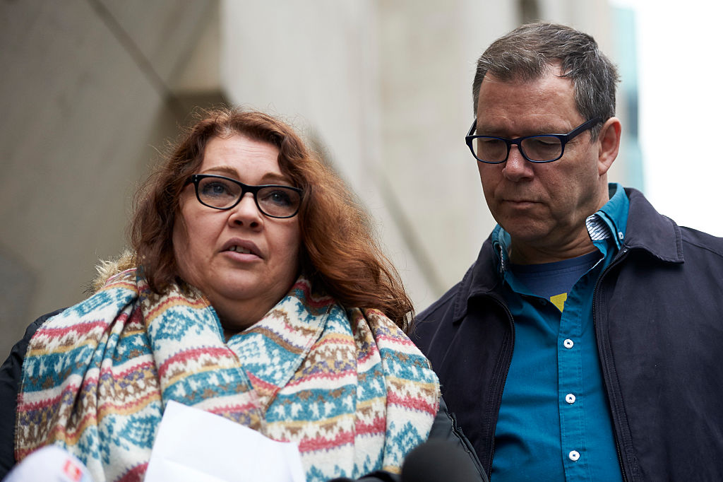Mandy Pearson (L), stepmother of slain 21 year old Daniel Whitworth stands by her husband Adam Whitworth as she delivers a statement to the media outside the Central Criminal Court in London on November 23, 2016. 