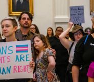 A person holds up a sign reading "trans rights are human rights" during a protest as lawmakers across the US including Texas and Tennessee file bills attacking LGBTQ+ rights