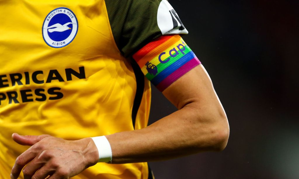Brighton and Hove player wears a rainbow armband.