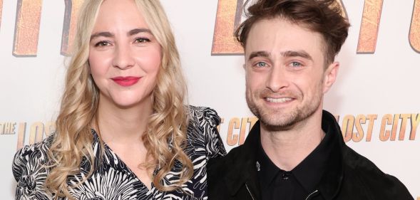 Erine Darke and Daniel Radcliffe pose for a red carpet photo.