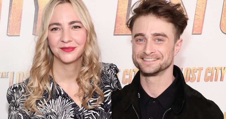 Erine Darke and Daniel Radcliffe pose for a red carpet photo.
