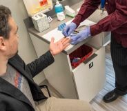 An individual gets their blood taken as part of an HIV test.