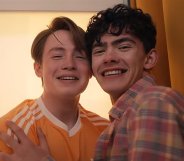 Kit Connor as Nick nelson (left) and Joe Locke as Charlie Spring (right), hugging in a photo booth. Heartstopper will conclude with Volume 6.