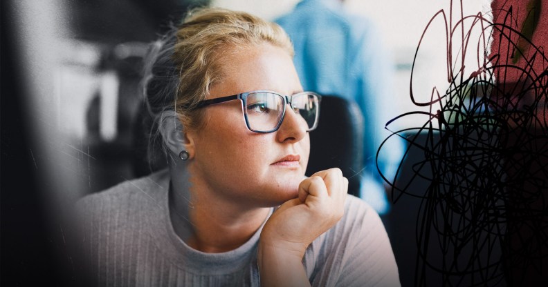 A female presenting person is looking out the window. They have eyeglasses on. They look stressed and there is a creative overlay for visual impact.