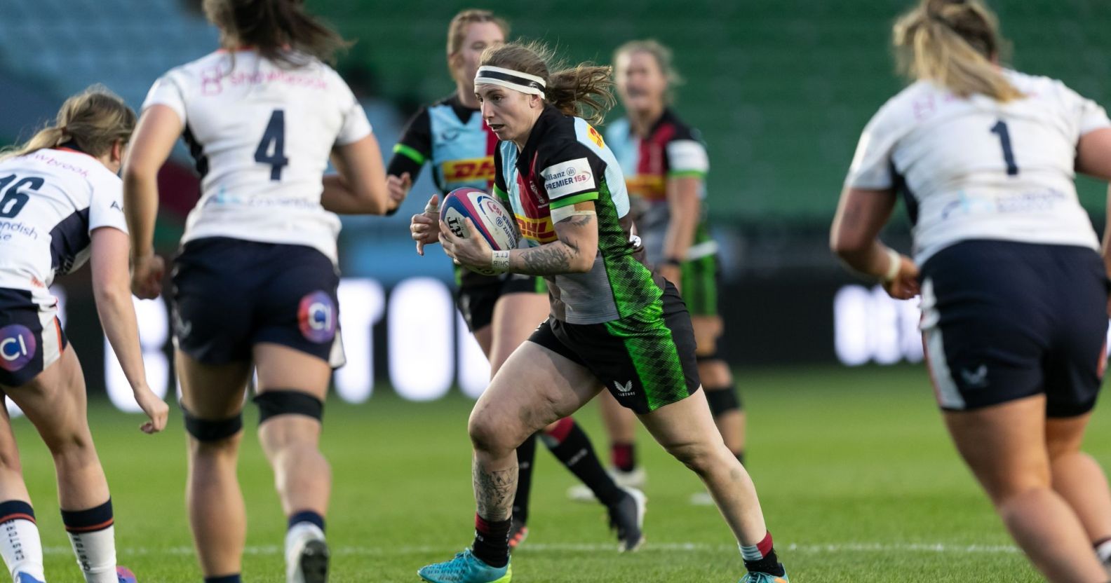 Jade Konkel-Roberts is a Harlequins rugby player.  Here she is pictured in the center playing with her teammates.