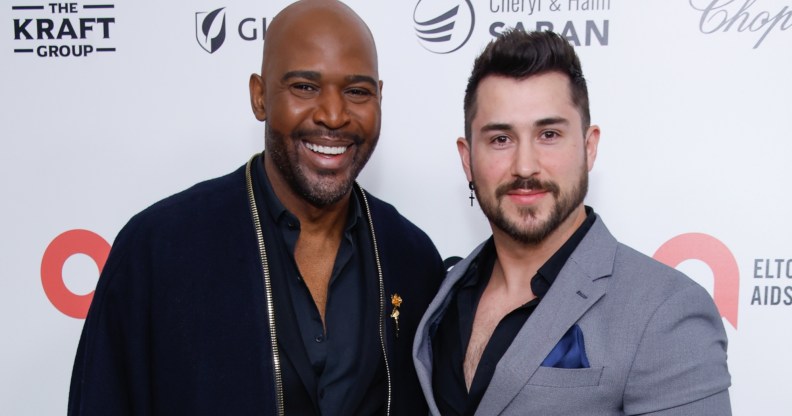 Karamo Brown (L) with partner Carlos Medel (R).